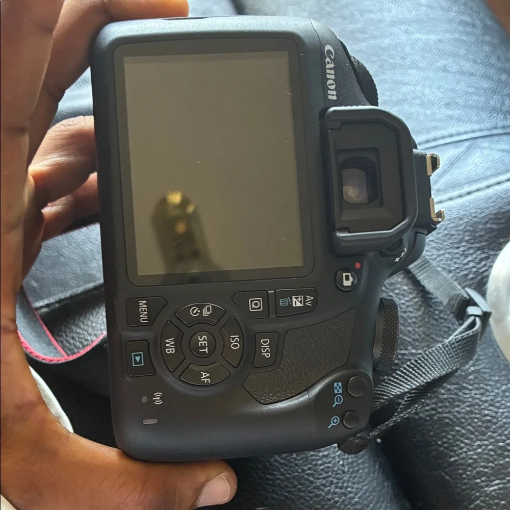 Canon DSLR Camera in Black with Red-Trim Strap